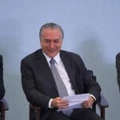 Brazilian President Michel Temer (C), Lower House President Rodrigo Maia and Chief of Staff Eliseu Padilha (R) attend a ceremony to promote new economy laws at Plantalto palace on October 27, 2016.Temer, who took over after the impeachment of Dilma Rousseff in August, urged an oil and gas conference in Rio de Janeiro to join what he said was an economy on the mend. / AFP / ANDRESSA ANHOLETE (Photo credit should read ANDRESSA ANHOLETE/AFP/Getty Images)