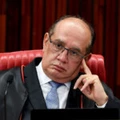 President of the Jury, Judge Gilmar Mendes, attends a meeting at the Supreme Electoral Court (TSE), on whether to invalidate the 2014 presidential election because of illegal campaign funding, in Brasilia, on April 4, 2017. 
Brazil's Supreme Electoral Court met Tuesday on whether to invalidate the 2014 presidential election because of illegal campaign funding -- a ruling that could in theory force out President Michel Temer. At issue are allegations that when then president Dilma Rousseff ran for re-election in 2014, with Temer as vice president, their ticket was financed by undeclared funds or bribes. Both Temer and Rousseff deny any wrongdoing. / AFP PHOTO / EVARISTO SA        (Photo credit should read EVARISTO SA/AFP/Getty Images)