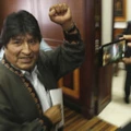 In this Nov. 27, 2019 photo, Bolivia's former President Evo Morales pumps his fist after a press conference at the journalists club in Mexico City. Morales went into exile in Mexico after he was prodded by police and the military, forcing him to resigned on Nov. 10, after he claimed victory in an election that international observers invited in by the government said was marred by numerous irregularities. (AP Photo/Marco Ugarte)