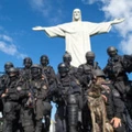 Members of the Elite Unit of the Brazilian Military Police (BOPE) pose under the Christ the Reedemer statue after practicing maneuvers on Corcovado Hill in Rio de Janeiro, Brazil, on April 6, 2013. Rio de Janeiro will host matches of the FIFA Confederation Cup in June and the 2013 World Youth Day international Catholic gathering in July.   AFP PHOTO / CHRISTOPHE SIMON        (Photo credit should read CHRISTOPHE SIMON/AFP/Getty Images)