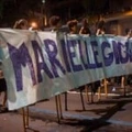 A group of women on stilts hold a banner reading "Giant Marielle" during a protest against the murder of Brazilian councilwoman and activist Marielle Franco in Rio de Janeiro, Brazil on March 15, 2018. Brazilians mourned for the Rio de Janeiro councilwoman and outspoken critic of police brutality who was shot in the city center in an assassination-style killing on the eve. / AFP PHOTO / Mauro Pimentel (Photo credit should read MAURO PIMENTEL/AFP/Getty Images)