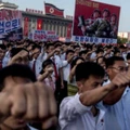 People wave banners and shout slogans as they attend a rally in support of North Korea's stance against the US, on Kim Il-Sung square in Pyongyang on August 9, 2017. US President Donald Trump said the United States' nuclear arsenal was "more powerful than ever" in a fresh warning to North Korea over its repeated missile tests. / AFP PHOTO / KIM Won-Jin        (Photo credit should read KIM WON-JIN/AFP/Getty Images)