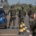 Members of the Brazilian Army check vehicles traveling along BR 174 highway, often used by Venezuelans seeking shelter in Brazil, in Pacaraima, Roraima state, Brazil, on Tuesday, Feb. 20, 2018.