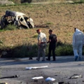 TOPSHOT - Police and forensic experts inspect the wreckage of a car bomb believed to have killed journalist and blogger Daphne Caruana Galizia close to her home in Bidnija, Malta, on October 16, 2017. The force of the blast broke her car into several pieces and catapulted the journalist's body into a nearby field, witnesses said. She leaves a husband and three sons.Caruana Galizia's death comes four months after Prime Minister Joseph Muscat's Labour Party won a resounding victory in a general election he called early as a result of scandals to which Caruana Galizia's allegations were central.  / AFP PHOTO / STR / Malta OUT        (Photo credit should read STR/AFP/Getty Images)
