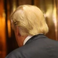 NEW YORK, NY - DECEMBER 06:  U.S. President-Elect Donald Trump walks back into an elevator after emerging for a minute to speak to the media at Trump Tower following meetings on December 6, 2016 in New York City. Potential members of President-elect Donald Trump's cabinet have been meeting with him and his transition team of the last few weeks.  (Photo by Spencer Platt/Getty Images)