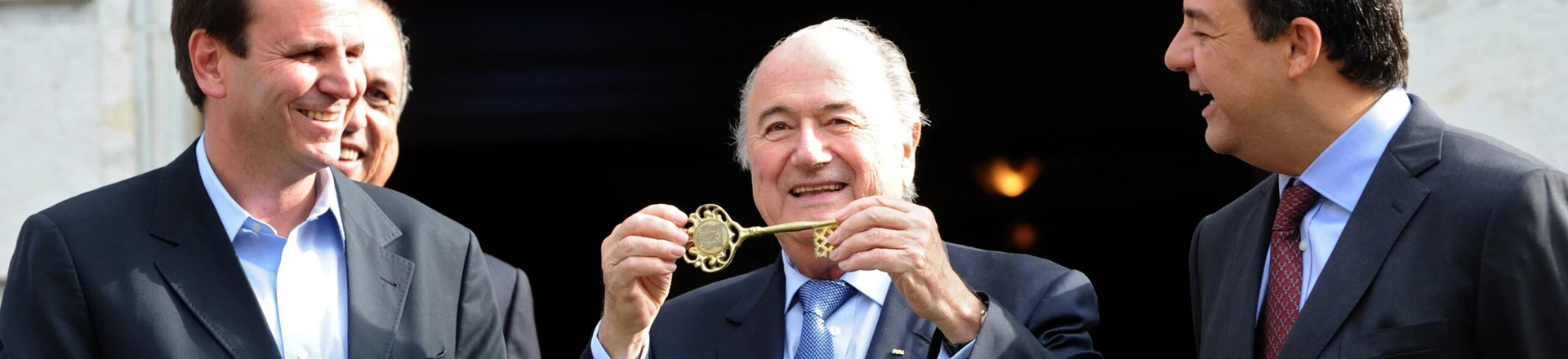 FIFA's President Joseph S. Blatter (C) shows the Rio de Janeiro City key next to Rio de Janeiro's Major Eduardo Paes (L) and Rio de Janeiro's Governor Sergio Cabral at the City Palace in Rio de Janeiro, Brazil, on July 29, 2011. Blatter is in Rio de Janeiro to take part in the Preliminary draw for the FIFA World Cup 2014 which will be held on Saturday. AFP PHOTO/Evaristo SA (Photo credit should read EVARISTO SA/AFP/Getty Images) FIFA's President Joseph S. Blatter (C) shows the Rio de Janeiro City key next to Rio de Janeiro's Major Eduardo Paes (L) and Rio de Janeiro's Governor Sergio Cabral at the City Palace in Rio de Janeiro, Brazil, on July 29, 2011. Blatter is in Rio de Janeiro to take part in the Preliminary draw for the FIFA World Cup 2014 which will be held on Saturday. AFP PHOTO/Evaristo SA (Photo credit should read EVARISTO SA/AFP/Getty Images)