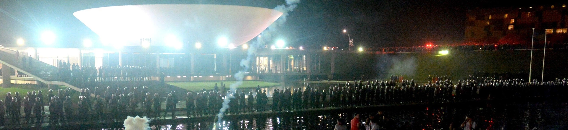 Police use tear gas against demonstrators during a protest against government waste and corruption, and the use of public funds to organize international football tournaments in front of the National Congress in Brasilia, on June 26, 2013. Brazil is currently facing unprecedented social unrest, marked by almost daily street protests to demand better public services and an end to rampant political corruption, the protests come as Brazil hosts the FIFA 2013 Confederations Cup. AFP PHOTO /        (Photo credit should read EVARISTO SA/AFP/Getty Images)