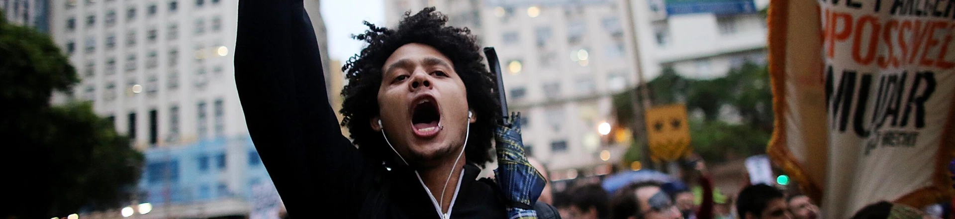 RIO DE JANEIRO, BRAZIL - OCTOBER 31: Anti-government protesters march through the Centro district on October 31, 2013 in Rio de Janeiro, Brazil. Protesters called for an end to police violence and corruption and voiced demands for better public services. (Photo by Mario Tama/Getty Images) RIO DE JANEIRO, BRAZIL - OCTOBER 31: Anti-government protesters march through the Centro district on October 31, 2013 in Rio de Janeiro, Brazil. Protesters called for an end to police violence and corruption and voiced demands for better public services. (Photo by Mario Tama/Getty Images)