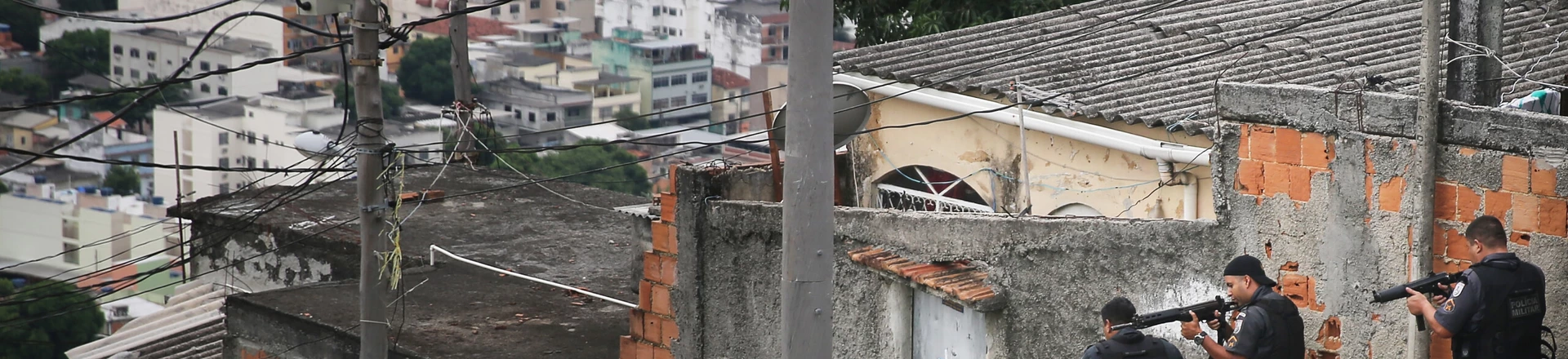 RIO DE JANEIRO, BRAZIL - MARCH 21: Military Police (PM) conduct an operation in the 'pacified' Complexo do Alemao 'favela' community following a shootout earlier in the day on March 21, 2015 in Rio de Janeiro, Brazil. The complex of favelas has suffered numerous shootouts recently. The government recently created a commission with the objective to increase social projects in communities such as Complexo do Alemao that have a Pacifying Police Unit (UPP). The new aim acknowledges that the communities, many of which remain plagued by violence and other issues, cannot solely be ?pacified? by police operations. (Photo by Mario Tama/Getty Images) RIO DE JANEIRO, BRAZIL - MARCH 21: Military Police (PM) conduct an operation in the 'pacified' Complexo do Alemao 'favela' community following a shootout earlier in the day on March 21, 2015 in Rio de Janeiro, Brazil. The complex of favelas has suffered numerous shootouts recently. The government recently created a commission with the objective to increase social projects in communities such as Complexo do Alemao that have a Pacifying Police Unit (UPP). The new aim acknowledges that the communities, many of which remain plagued by violence and other issues, cannot solely be ?pacified? by police operations. (Photo by Mario Tama/Getty Images)