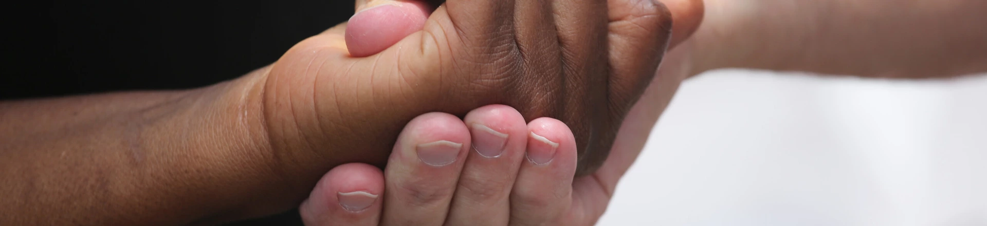CHARLESTON, SC - JULY 17: People clasp hands in prayer in front of the Emanuel African Methodist Episcopal Church on July 17, 2015 in Charleston, South Carolina. Visitors from around the nation continue to pay their respects at a makeshift shrine at the church, in a show of faith and solidarity with "Mother Emanuel", as the church is known in Charleston. Nine people were allegedly murdered on June 17 by 21-year-old white supremacist Dylann Roof, who was captured by police in North Carolina the following day. He is scheduled to go to trial July 11, 2016. (Photo by John Moore/Getty Images) CHARLESTON, SC - JULY 17: People clasp hands in prayer in front of the Emanuel African Methodist Episcopal Church on July 17, 2015 in Charleston, South Carolina. Visitors from around the nation continue to pay their respects at a makeshift shrine at the church, in a show of faith and solidarity with "Mother Emanuel", as the church is known in Charleston. Nine people were allegedly murdered on June 17 by 21-year-old white supremacist Dylann Roof, who was captured by police in North Carolina the following day. He is scheduled to go to trial July 11, 2016. (Photo by John Moore/Getty Images)