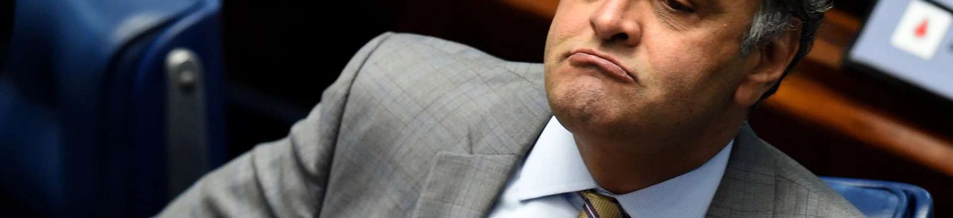 Senator Aecio Neves, who heads the PSDB opposition party, is pictured during a senate's session to form a committee that will consider whether to impeach President Dilma Rousseff, in Brasilia, on April 25, 2016.Brazil's Senate met Monday to form a committee that will consider whether to impeach Rousseff, who has accused her opponents of mounting a constitutional coup. She is accused of illegal government accounting maneuvers, but says she has not committed an impeachment-worthy crime. The Senate committee -- comprising 21 of the 81 senators -- was to debate Rousseff's fate for up to 10 working days before making a recommendation to the full upper house. / AFP / EVARISTO SA (Photo credit should read EVARISTO SA/AFP/Getty Images) Senator Aecio Neves, who heads the PSDB opposition party, is pictured during a senate's session to form a committee that will consider whether to impeach President Dilma Rousseff, in Brasilia, on April 25, 2016.Brazil's Senate met Monday to form a committee that will consider whether to impeach Rousseff, who has accused her opponents of mounting a constitutional coup. She is accused of illegal government accounting maneuvers, but says she has not committed an impeachment-worthy crime. The Senate committee -- comprising 21 of the 81 senators -- was to debate Rousseff's fate for up to 10 working days before making a recommendation to the full upper house. / AFP / EVARISTO SA (Photo credit should read EVARISTO SA/AFP/Getty Images)