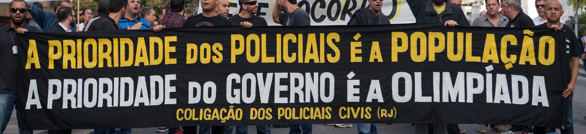 Civil police officers threatening to go on strike demonstrate against the government for arrears in their salary payments, in Rio de Janeiro, Brazil, June 27, 2016, tEarlier this month, Rio state authorities declared a "state of public calamity" over a major budget crisis in order to release emergency funds to finance the Olympic Games due to begin in August. / AFP / VANDERLEI ALMEIDA (Photo credit should read VANDERLEI ALMEIDA/AFP/Getty Images)