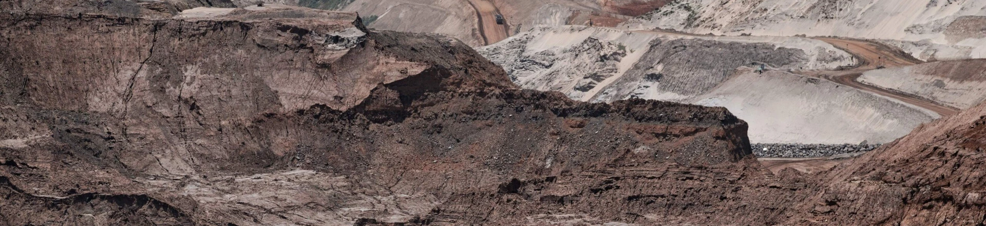 General view of the rebuilding site next to the collapsed iron ore waste dam of Brazilian mining company Samarco, in Mariana, Minas Gerais State, Brazil, on October 26, 2016.Next November 5 marks the first anniversary of the burst of the iron ore waste dam of Samarco -owned by BHP Billiton and Vale SA- which killed nineteen people and destroyed the ecosystem of the Doce River in the worst mining accident in Brazil's history. / AFP / YASUYOSHI CHIBA (Photo credit should read YASUYOSHI CHIBA/AFP/Getty Images) General view of the rebuilding site next to the collapsed iron ore waste dam of Brazilian mining company Samarco, in Mariana, Minas Gerais State, Brazil, on October 26, 2016.Next November 5 marks the first anniversary of the burst of the iron ore waste dam of Samarco -owned by BHP Billiton and Vale SA- which killed nineteen people and destroyed the ecosystem of the Doce River in the worst mining accident in Brazil's history. / AFP / YASUYOSHI CHIBA (Photo credit should read YASUYOSHI CHIBA/AFP/Getty Images)
