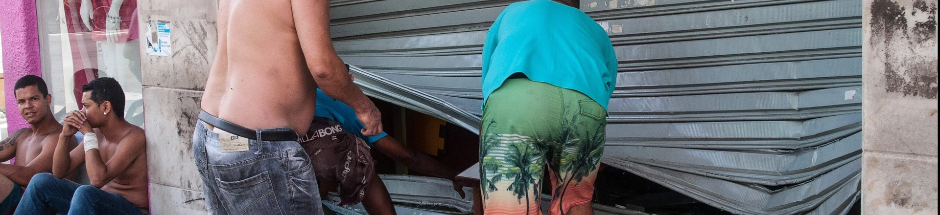 Men fix the broken shutter of their shop after burglars entered in Vila Velha, near Vitoria, eastern Brazil, on February 6, 2016. Brazil's government authorized deployment of troops Monday to the coastal city of Vitoria, which has been left at the mercy of criminals following a police strike. / AFP / Vinicius Moraes (Photo credit should read VINICIUS MORAES/AFP/Getty Images) Men fix the broken shutter of their shop after burglars entered in Vila Velha, near Vitoria, eastern Brazil, on February 6, 2016. Brazil's government authorized deployment of troops Monday to the coastal city of Vitoria, which has been left at the mercy of criminals following a police strike. / AFP / Vinicius Moraes (Photo credit should read VINICIUS MORAES/AFP/Getty Images)