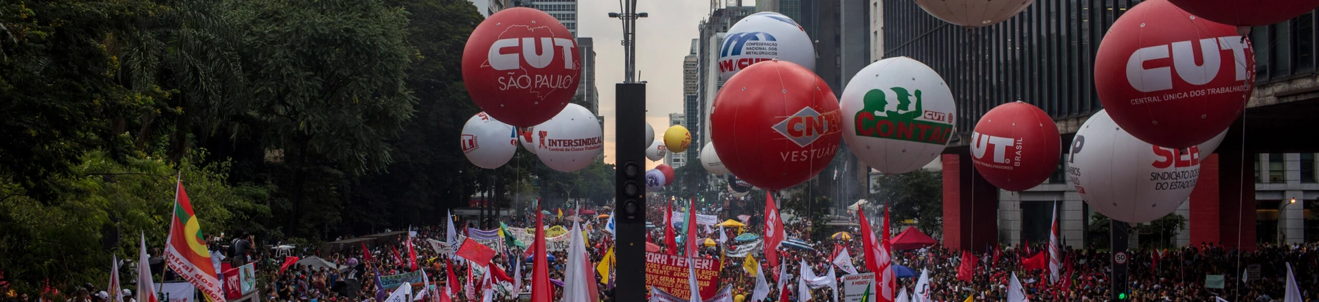 SAO PAULO, BRAZIL - MARCH 15: People protest against the pension reform proposed by President Michel Temer's government on March 15, 2017 in Sao Paulo, Brazil. Thousands of teachers, drivers from the transport system, bankers and various unions gathered on Avenida Paulista during a nationwide strike to protest the increase in time people must work before retirement. (Photo by Victor Moriyama/Getty Images) SAO PAULO, BRAZIL - MARCH 15: People protest against the pension reform proposed by President Michel Temer's government on March 15, 2017 in Sao Paulo, Brazil. Thousands of teachers, drivers from the transport system, bankers and various unions gathered on Avenida Paulista during a nationwide strike to protest the increase in time people must work before retirement. (Photo by Victor Moriyama/Getty Images)