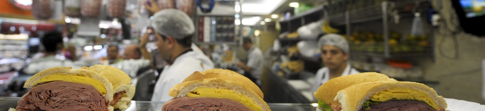 Workers make mortadella sandwiches at a cafeteria in the municipal market in Sao Paulo, Brazil, March 15, 2010 in Brazil.   AFP PHOTO/ANTONIO SCORZA (Photo credit should read ANTONIO SCORZA/AFP/Getty Images) Workers make mortadella sandwiches at a cafeteria in the municipal market in Sao Paulo, Brazil, March 15, 2010 in Brazil.   AFP PHOTO/ANTONIO SCORZA (Photo credit should read ANTONIO SCORZA/AFP/Getty Images)