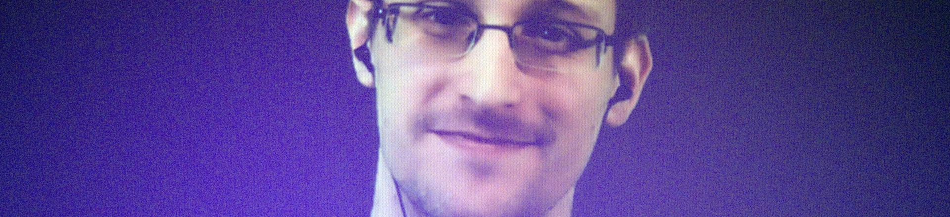 Former U.S. National Security Agency contractor Edward Snowden, who is in Moscow, is seen on a giant screen during a live video conference for an interview as part of Amnesty International's annual Write for Rights campaign at the Gaite Lyrique in Paris, France, Dec. 10, 2014. (AP Photo/Charles Platiau, Pool) Former U.S. National Security Agency contractor Edward Snowden, who is in Moscow, is seen on a giant screen during a live video conference for an interview as part of Amnesty International's annual Write for Rights campaign at the Gaite Lyrique in Paris, France, Dec. 10, 2014. (AP Photo/Charles Platiau, Pool)