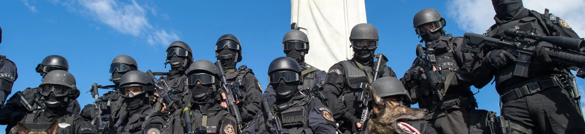 Members of the Elite Unit of the Brazilian Military Police (BOPE) pose under the Christ the Reedemer statue after practicing maneuvers on Corcovado Hill in Rio de Janeiro, Brazil, on April 6, 2013. Rio de Janeiro will host matches of the FIFA Confederation Cup in June and the 2013 World Youth Day international Catholic gathering in July. AFP PHOTO / CHRISTOPHE SIMON (Photo credit should read CHRISTOPHE SIMON/AFP/Getty Images) Members of the Elite Unit of the Brazilian Military Police (BOPE) pose under the Christ the Reedemer statue after practicing maneuvers on Corcovado Hill in Rio de Janeiro, Brazil, on April 6, 2013. Rio de Janeiro will host matches of the FIFA Confederation Cup in June and the 2013 World Youth Day international Catholic gathering in July. AFP PHOTO / CHRISTOPHE SIMON (Photo credit should read CHRISTOPHE SIMON/AFP/Getty Images)