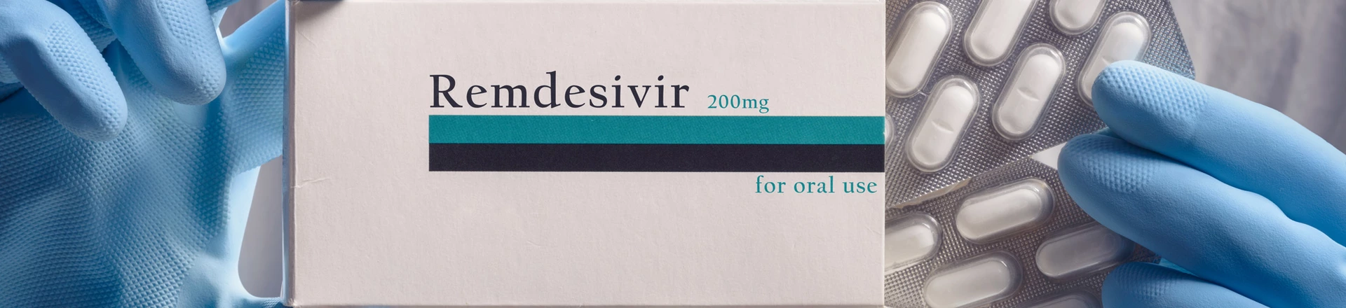 Medical worker holding pack of remdesivir pills Medical worker holding pack of remdesivir pills