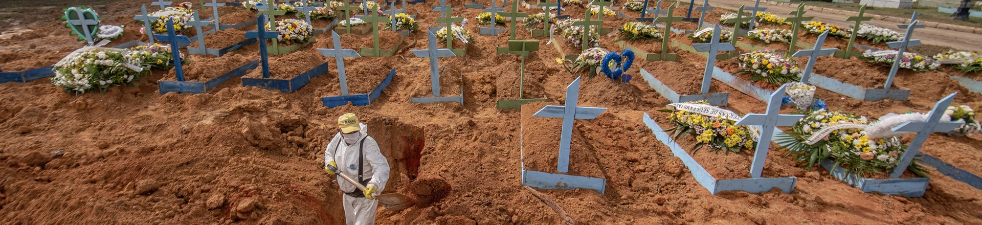 Worker wearing personal protective equipment (PPE) digs a grave at a cemetery in Manaus, Brazil, on Tuesday, Jan. 19, 2021. Severe oxygen shortages at hospitals in Brazil's Amazon prompted local authorities to impose a curfew and airlift patients to other states to deal with the onslaught of a second coronavirus wave. Photographer: Jonne Roriz/Bloomberg via Getty Images Worker wearing personal protective equipment (PPE) digs a grave at a cemetery in Manaus, Brazil, on Tuesday, Jan. 19, 2021. Severe oxygen shortages at hospitals in Brazil's Amazon prompted local authorities to impose a curfew and airlift patients to other states to deal with the onslaught of a second coronavirus wave. Photographer: Jonne Roriz/Bloomberg via Getty Images