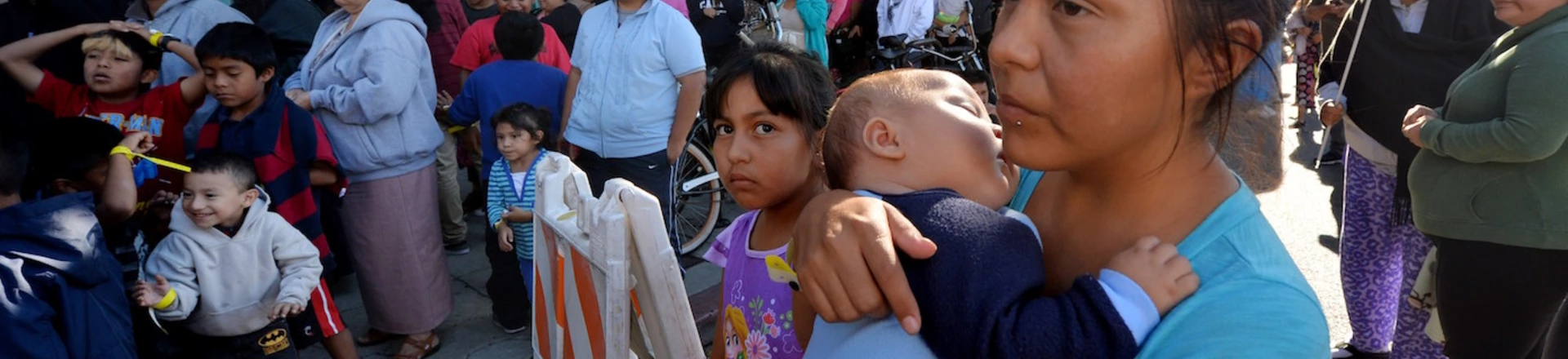 Mothers and their children wait for new shoes and school supplies during a charity event to help more than 4,000 underprivileged children at the Fred Jordan Mission in the Skid Row area of Los Angeles on October 2, 2014. Skid Row reportedly contains one of the largest populations of homeless people in the United States.                  AFP PHOTO/Mark RALSTON        (Photo credit should read MARK RALSTON/AFP/Getty Images) Mothers and their children wait for new shoes and school supplies during a charity event to help more than 4,000 underprivileged children at the Fred Jordan Mission in the Skid Row area of Los Angeles on October 2, 2014. Skid Row reportedly contains one of the largest populations of homeless people in the United States.                  AFP PHOTO/Mark RALSTON        (Photo credit should read MARK RALSTON/AFP/Getty Images)