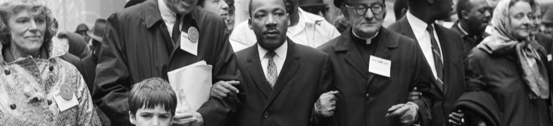 NEW YORK, UNITED STATES:  Civil rights leader Rev. Martin Luther King, Jr., (C) is accompanied by famed pediatrician Dr. Benjamin Spock (2nd-L), Father Frederick Reed (3rd-R) and union leader Cleveland Robinson (2nd-R) 16 March, 1967, during an anti-Vietnam War demonstration in New York. The US is celebrating in 2004 what would have been King's 75th birthday. King was assassinated on 04 April, 1968, in Memphis, Tennessee. AFP PHOTO (Photo credit should read AFP/AFP/Getty Images) NEW YORK, UNITED STATES:  Civil rights leader Rev. Martin Luther King, Jr., (C) is accompanied by famed pediatrician Dr. Benjamin Spock (2nd-L), Father Frederick Reed (3rd-R) and union leader Cleveland Robinson (2nd-R) 16 March, 1967, during an anti-Vietnam War demonstration in New York. The US is celebrating in 2004 what would have been King's 75th birthday. King was assassinated on 04 April, 1968, in Memphis, Tennessee. AFP PHOTO (Photo credit should read AFP/AFP/Getty Images)