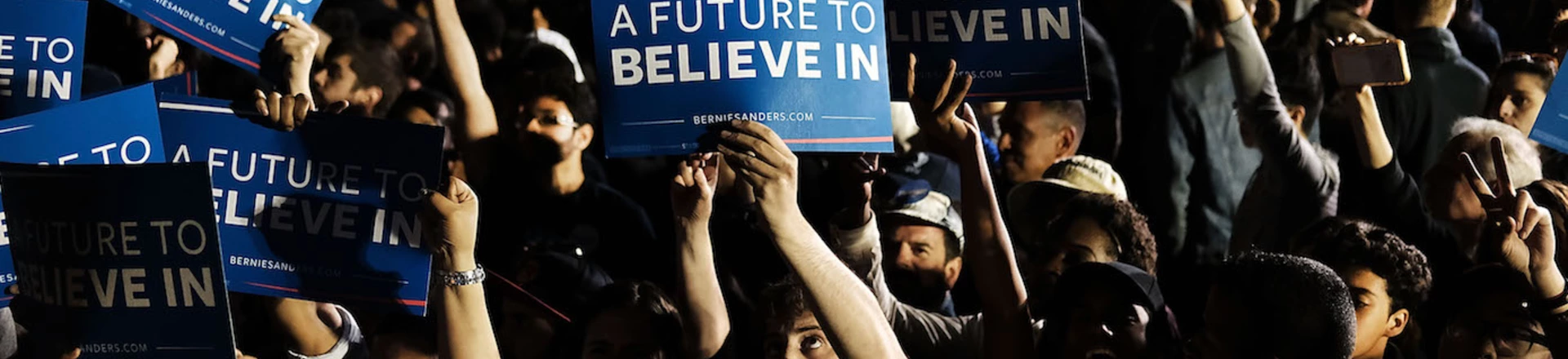 NEW YORK, NY - APRIL 18:  People cheer as Democratic Presidential candidate Bernie Sanders walks on stage at a campaign rally on the eve of the New York primary, April 18, 2016 in the Queens borough of New York City. While Sanders is still behind in the delegate count with Hillary Clinton, he has energized many young and liberal voters around the country. New York holds its primary this Tuesday.  (Photo by Spencer Platt/Getty Images)