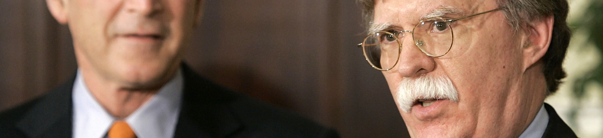 WASHINGTON - AUGUST 1: (L-R) U.S. President George W. Bush listens to John Bolton speak after being appointed to be ambassador to the United Nations during an event at the White House August 1, 2005 in Washington, DC. Bush has the power to fill vacancies without Senate approval while Congress is in recess. (Photo by Mark Wilson/Getty Images) WASHINGTON - AUGUST 1: (L-R) U.S. President George W. Bush listens to John Bolton speak after being appointed to be ambassador to the United Nations during an event at the White House August 1, 2005 in Washington, DC. Bush has the power to fill vacancies without Senate approval while Congress is in recess. (Photo by Mark Wilson/Getty Images)