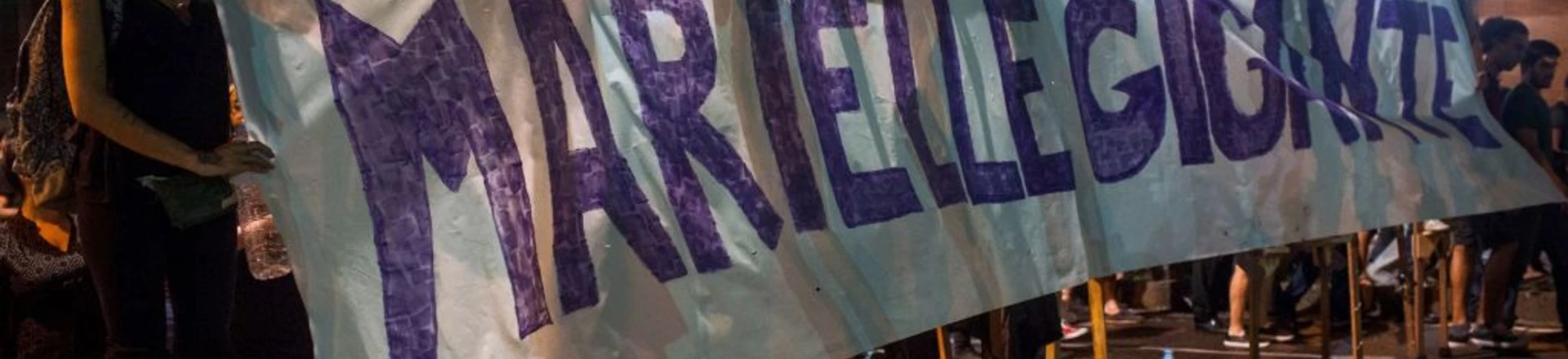 A group of women on stilts hold a banner reading "Giant Marielle" during a protest against the murder of Brazilian councilwoman and activist Marielle Franco in Rio de Janeiro, Brazil on March 15, 2018. Brazilians mourned for the Rio de Janeiro councilwoman and outspoken critic of police brutality who was shot in the city center in an assassination-style killing on the eve. / AFP PHOTO / Mauro Pimentel (Photo credit should read MAURO PIMENTEL/AFP/Getty Images) A group of women on stilts hold a banner reading "Giant Marielle" during a protest against the murder of Brazilian councilwoman and activist Marielle Franco in Rio de Janeiro, Brazil on March 15, 2018. Brazilians mourned for the Rio de Janeiro councilwoman and outspoken critic of police brutality who was shot in the city center in an assassination-style killing on the eve. / AFP PHOTO / Mauro Pimentel (Photo credit should read MAURO PIMENTEL/AFP/Getty Images)