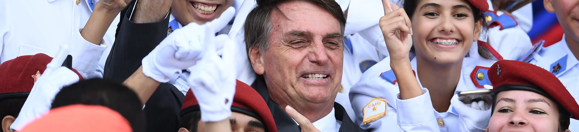 Brazilian congressman and presidential canditate for the next presidential election, Jair Bolsonaro (C), poses for pictures with students of Brasilia's Military School after a parade on the Brazilian Army commemorative day,in Brasilia, on April 19, 2018. (Photo by EVARISTO SA / AFP)        (Photo credit should read EVARISTO SA/AFP/Getty Images) Brazilian congressman and presidential canditate for the next presidential election, Jair Bolsonaro (C), poses for pictures with students of Brasilia's Military School after a parade on the Brazilian Army commemorative day,in Brasilia, on April 19, 2018. (Photo by EVARISTO SA / AFP)        (Photo credit should read EVARISTO SA/AFP/Getty Images)