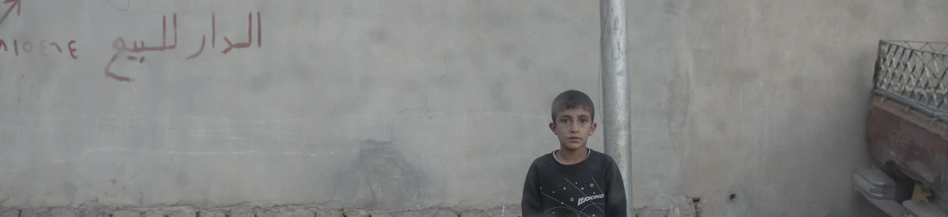A young boy stares at the photographer through the window of an Iraqi army Humvee in the Karkukli neighborhood of Mosul, Iraq on Nov. 17, 2016. A young boy stares at the photographer through the window of an Iraqi army Humvee in the Karkukli neighborhood of Mosul, Iraq on Nov. 17, 2016.