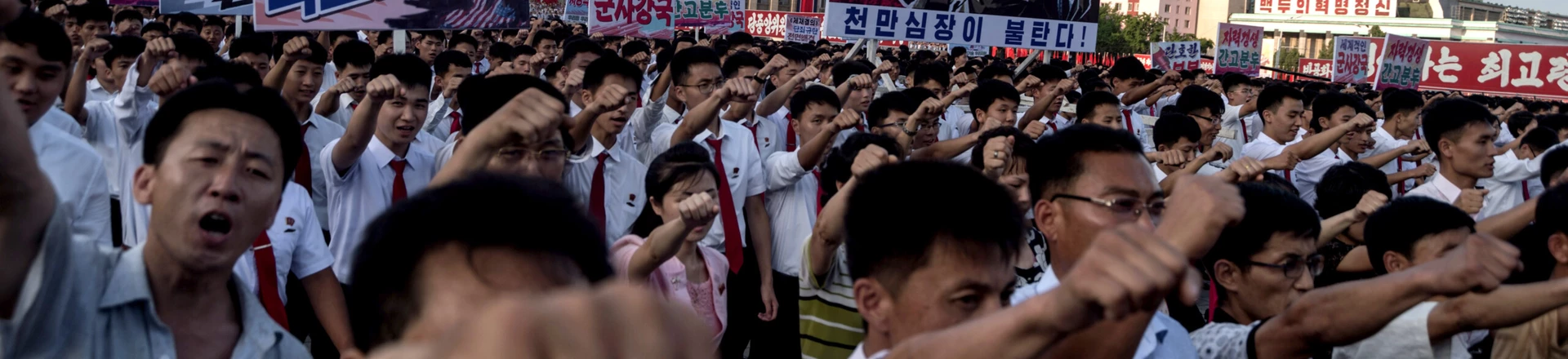 People wave banners and shout slogans as they attend a rally in support of North Korea's stance against the US, on Kim Il-Sung square in Pyongyang on August 9, 2017. 
US President Donald Trump said the United States' nuclear arsenal was "more powerful than ever" in a fresh warning to North Korea over its repeated missile tests. / AFP PHOTO / KIM Won-Jin        (Photo credit should read KIM WON-JIN/AFP/Getty Images) People wave banners and shout slogans as they attend a rally in support of North Korea's stance against the US, on Kim Il-Sung square in Pyongyang on August 9, 2017. 
US President Donald Trump said the United States' nuclear arsenal was "more powerful than ever" in a fresh warning to North Korea over its repeated missile tests. / AFP PHOTO / KIM Won-Jin        (Photo credit should read KIM WON-JIN/AFP/Getty Images)