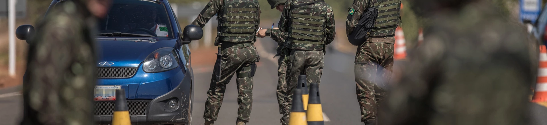 Members of the Brazilian Army check vehicles traveling along BR 174 highway, often used by Venezuelans seeking shelter in Brazil, in Pacaraima, Roraima state, Brazil, on Tuesday, Feb. 20, 2018. Members of the Brazilian Army check vehicles traveling along BR 174 highway, often used by Venezuelans seeking shelter in Brazil, in Pacaraima, Roraima state, Brazil, on Tuesday, Feb. 20, 2018.