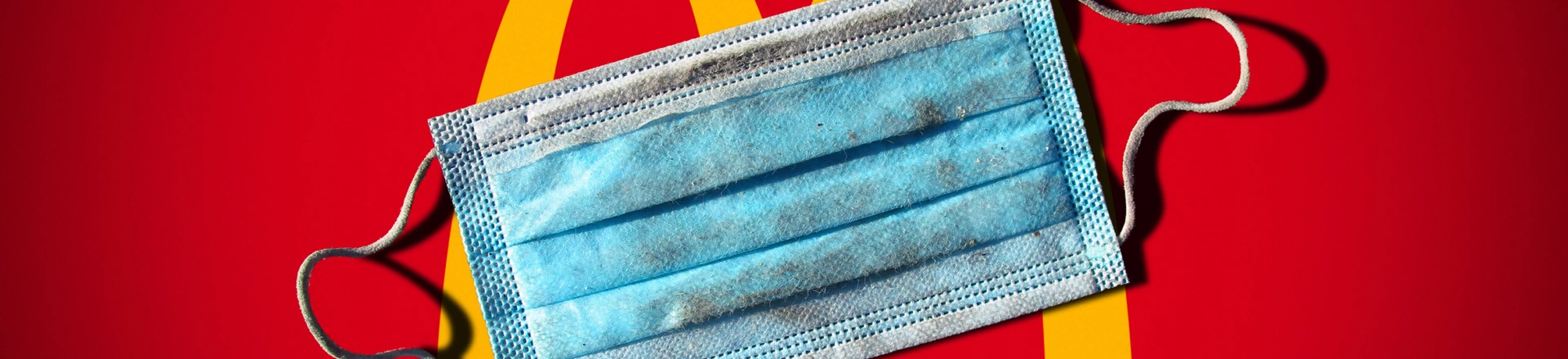 A protective mask against the Coronavirus thrown in the street after its use. No visible trademark. Bitumen background. Natural light. Paris, France. A protective mask against the Coronavirus thrown in the street after its use. No visible trademark. Bitumen background. Natural light. Paris, France.