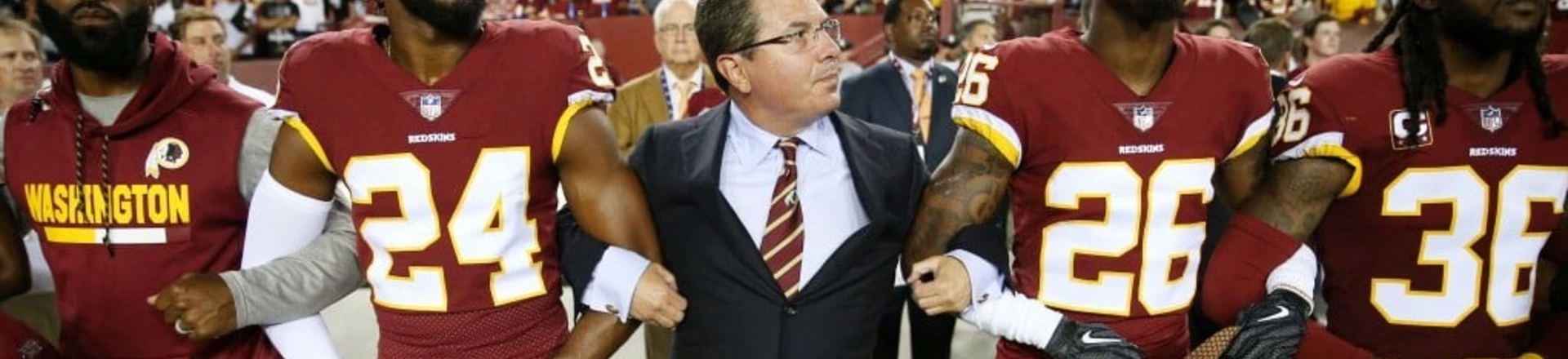 Washington Redskins Owner Daniel Synder stands with cornerback Josh Norman (24) and cornerback Bashaud Breeland (26) during the the national anthem before the NFL football game against the Oakland Raiders at FedExField on Sept. 24, 2017 in Landover, Md. Washington Redskins Owner Daniel Synder stands with cornerback Josh Norman (24) and cornerback Bashaud Breeland (26) during the the national anthem before the NFL football game against the Oakland Raiders at FedExField on Sept. 24, 2017 in Landover, Md.
