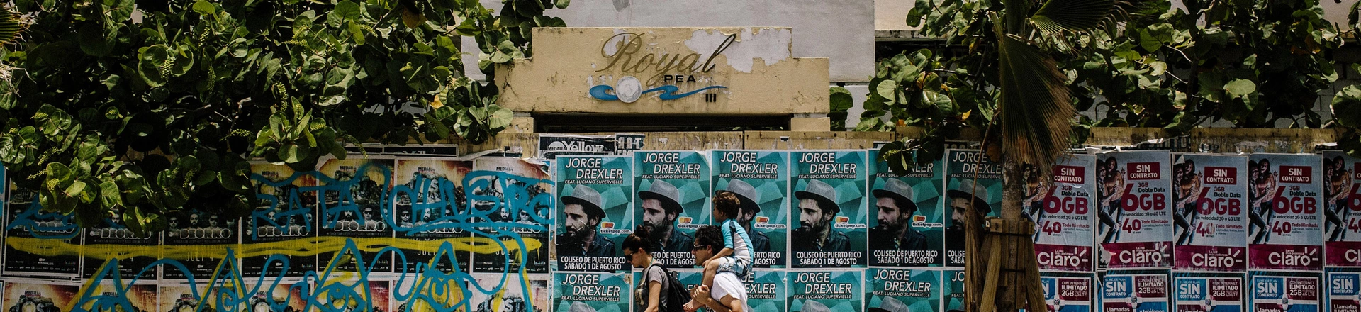 Pedestrians walk past an old hotel in the Condado area of San Juan, Puerto Rico, on Wednesday, July 8, 2015. A growing number of Republicans in the U.S. Congress are saying they want to support Puerto Rico as it wrestles with an escalating debt crisis, though they've stopped short of backing legislation allowing for municipal bankruptcy. Photographer: Christopher Gregory/Bloomberg via Getty Images Pedestrians walk past an old hotel in the Condado area of San Juan, Puerto Rico, on Wednesday, July 8, 2015. A growing number of Republicans in the U.S. Congress are saying they want to support Puerto Rico as it wrestles with an escalating debt crisis, though they've stopped short of backing legislation allowing for municipal bankruptcy. Photographer: Christopher Gregory/Bloomberg via Getty Images