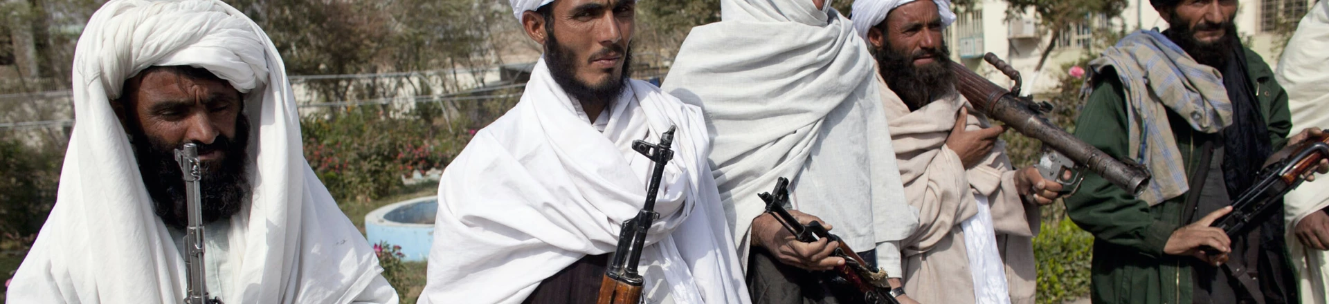 HERAT, AFGHANISTAN - NOVEMBER 4: Surrendering Taliban militants stand with their weapons as they are presented to the media on November 4, 2010 in Herat, Afghanistan. Twenty Taliban fighters from Afghanistan's Herat province have surrendered to government troops in Herat, west of the capital city of Kabul. After an amnesty launched by President Hamid Karzai in November 2004, hundreds of anti-government Taliban militants have since surrendered to the government. (Photo by Majid Saeedi/Getty Images) HERAT, AFGHANISTAN - NOVEMBER 4: Surrendering Taliban militants stand with their weapons as they are presented to the media on November 4, 2010 in Herat, Afghanistan. Twenty Taliban fighters from Afghanistan's Herat province have surrendered to government troops in Herat, west of the capital city of Kabul. After an amnesty launched by President Hamid Karzai in November 2004, hundreds of anti-government Taliban militants have since surrendered to the government. (Photo by Majid Saeedi/Getty Images)