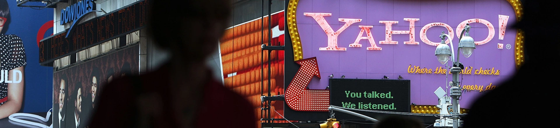 NEW YORK - JULY 29:  Pedestrians walk by a Yahoo sign in Times Square on July 29, 2009 in New York City. Taking aim at Google?s dominance, technology companies Microsoft and Yahoo announced Wednesday that they have reached a 10 year internet search partnership.  (Photo by Spencer Platt/Getty Images) NEW YORK - JULY 29:  Pedestrians walk by a Yahoo sign in Times Square on July 29, 2009 in New York City. Taking aim at Google?s dominance, technology companies Microsoft and Yahoo announced Wednesday that they have reached a 10 year internet search partnership.  (Photo by Spencer Platt/Getty Images)