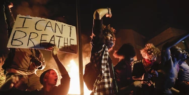 Protestors demonstrate outside of a burning Minneapolis 3rd Police Precinct, Thursday, May 28, 2020, in Minneapolis. Protests over the death of George Floyd, a black man who died in police custody Monday, broke out in Minneapolis for a third straight night. (AP Photo/John Minchillo) Protestors demonstrate outside of a burning Minneapolis 3rd Police Precinct, Thursday, May 28, 2020, in Minneapolis. Protests over the death of George Floyd, a black man who died in police custody Monday, broke out in Minneapolis for a third straight night. (AP Photo/John Minchillo)