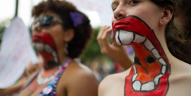 Women with their upper bodies painted pose as they take part in a protest against violence against women during the celebration of the International Women's Day on March 8, 2013, in Sao Paulo, Brazil. AFP PHOTO/YASUYOSHI CHIBA        (Photo credit should read YASUYOSHI CHIBA/AFP/Getty Images) Women with their upper bodies painted pose as they take part in a protest against violence against women during the celebration of the International Women's Day on March 8, 2013, in Sao Paulo, Brazil. AFP PHOTO/YASUYOSHI CHIBA        (Photo credit should read YASUYOSHI CHIBA/AFP/Getty Images)