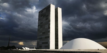 BRASILIA, BRAZIL - OCTOBER 27: The Brazilian National Congress building is shown on October 27, 2014 in Brasilia, Brazil. Brazil's left-wing President Dilma Rousseff was narrowly re-elected yesterday and will serve another four years in Brazil's unique planned capital city. The modernist city was founded in 1960 and replaced Rio de Janeiro as the federal capital of Brazil. The city was designed by urban planner Lucio Costa and architect Oscar Niemeyer and is now a UNESCO World Hertiage site. (Photo by Mario Tama/Getty Images) BRASILIA, BRAZIL - OCTOBER 27: The Brazilian National Congress building is shown on October 27, 2014 in Brasilia, Brazil. Brazil's left-wing President Dilma Rousseff was narrowly re-elected yesterday and will serve another four years in Brazil's unique planned capital city. The modernist city was founded in 1960 and replaced Rio de Janeiro as the federal capital of Brazil. The city was designed by urban planner Lucio Costa and architect Oscar Niemeyer and is now a UNESCO World Hertiage site. (Photo by Mario Tama/Getty Images)