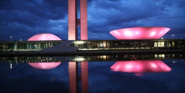 BRASILIA, BRAZIL - OCTOBER 27:  The Brazilian National Congress building is lit at dusk on October 27, 2014 in Brasilia, Brazil. Brazil's left-wing President Dilma Rousseff was narrowly re-elected yesterday and will serve another four years in Brazil's unique planned capital city. The modernist city was founded in 1960 and replaced Rio de Janeiro as the federal capital of Brazil. The city was designed by urban planner Lucio Costa and architect Oscar Niemeyer and is now a UNESCO World Hertiage site.  (Photo by Mario Tama/Getty Images) BRASILIA, BRAZIL - OCTOBER 27:  The Brazilian National Congress building is lit at dusk on October 27, 2014 in Brasilia, Brazil. Brazil's left-wing President Dilma Rousseff was narrowly re-elected yesterday and will serve another four years in Brazil's unique planned capital city. The modernist city was founded in 1960 and replaced Rio de Janeiro as the federal capital of Brazil. The city was designed by urban planner Lucio Costa and architect Oscar Niemeyer and is now a UNESCO World Hertiage site.  (Photo by Mario Tama/Getty Images)