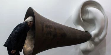 A visitor peers into US artist John Baldessari's "Beethoven's Trumpet (With Ear) Opus # 133" at the Art Basel fair in Hong Kong on March 15, 2015. Hong Kong's biggest art fair, Art Basel, opened its doors with thousands of visitors expected for a city-wide canvas of creativity and commerce. AFP PHOTO / ANTHONY WALLACEMANDATORY MENTION OF THE ARTIST, TO ILLUSTRATE THE EVENT AS SPECIFIED IN THE CAPTION (Photo credit should read ANTHONY WALLACE/AFP/Getty Images) A visitor peers into US artist John Baldessari's "Beethoven's Trumpet (With Ear) Opus # 133" at the Art Basel fair in Hong Kong on March 15, 2015. Hong Kong's biggest art fair, Art Basel, opened its doors with thousands of visitors expected for a city-wide canvas of creativity and commerce. AFP PHOTO / ANTHONY WALLACEMANDATORY MENTION OF THE ARTIST, TO ILLUSTRATE THE EVENT AS SPECIFIED IN THE CAPTION (Photo credit should read ANTHONY WALLACE/AFP/Getty Images)