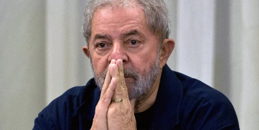 Former Brazilian President (2003-2011) Luiz Inacio Lula da Silva gestures during a meeting with the Workers' Party (PT) members in Sao Paulo, Brazil on March 30, 2015 AFP PHOTO / Nelson ALMEIDA        (Photo credit should read NELSON ALMEIDA/AFP/Getty Images)