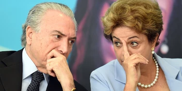 Brazilian President Dilma Rousseff (R) and Vice-President Michel Temer attend the launching ceremony of the Investment Program in Energy at Planalto Palace in Brasilia, on August 11, 2015. Analysts say Brazil's once booming economy suffers deep underlying illnesses, notably the massive corruption scandal unfolding at national oil company Petrobras and rippling across other top companies and into political circles. It is also on the brink of recession. According to a recent poll that put Rousseff's approval rating at eight percent, she is now Brazil's most unpopular democratically elected president since a military dictatorship ended in 1985.   AFP PHOTO / EVARISTO SA        (Photo credit should read EVARISTO SA/AFP/Getty Images) Brazilian President Dilma Rousseff (R) and Vice-President Michel Temer attend the launching ceremony of the Investment Program in Energy at Planalto Palace in Brasilia, on August 11, 2015. Analysts say Brazil's once booming economy suffers deep underlying illnesses, notably the massive corruption scandal unfolding at national oil company Petrobras and rippling across other top companies and into political circles. It is also on the brink of recession. According to a recent poll that put Rousseff's approval rating at eight percent, she is now Brazil's most unpopular democratically elected president since a military dictatorship ended in 1985.   AFP PHOTO / EVARISTO SA        (Photo credit should read EVARISTO SA/AFP/Getty Images)