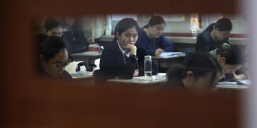 SEOUL, SOUTH KOREA - NOVEMBER 12:  South Korean students take their College Scholastic Ability Test at a school on November 12, 2014 in Seoul, South Korea. More than 630,000 high school seniors and graduates sit for the examinations at 1,212 test centers across the country, where academic records are all important. Success in the exam, one of the most rigourous standardized tests in the world, enables students to study at Korea's top universities.  (Photo by Chung Sung-Jun/Getty Images)