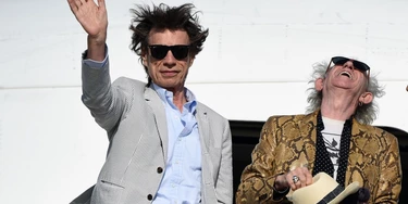British The Rolling Stones' Mick Jagger waves next to Keith Richards upon arrival in Montevideo on February 15, 2016, on the eve of their presentation within the America Latina Ole Tour. AFP PHOTO / PABLO PORCIUNCULA / AFP / PABLO PORCIUNCULA (Photo credit should read PABLO PORCIUNCULA/AFP/Getty Images) British The Rolling Stones' Mick Jagger waves next to Keith Richards upon arrival in Montevideo on February 15, 2016, on the eve of their presentation within the America Latina Ole Tour. AFP PHOTO / PABLO PORCIUNCULA / AFP / PABLO PORCIUNCULA (Photo credit should read PABLO PORCIUNCULA/AFP/Getty Images)