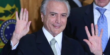 BRASILIA, BRAZIL - MAY 12:  Brazil's interim President Michel Temer waves at a signing ceremony for new government ministers at the Planalto presidential palace after the Senate voted to accept impeachment charges against suspended President Dilma Rousseff on May 12, 2016 in Brasilia, Brazil. Rousseff has been suspended from her presidential duties and will face a Senate trial for alleged manipulation of government accounts.  (Photo by Mario Tama/Getty Images) BRASILIA, BRAZIL - MAY 12:  Brazil's interim President Michel Temer waves at a signing ceremony for new government ministers at the Planalto presidential palace after the Senate voted to accept impeachment charges against suspended President Dilma Rousseff on May 12, 2016 in Brasilia, Brazil. Rousseff has been suspended from her presidential duties and will face a Senate trial for alleged manipulation of government accounts.  (Photo by Mario Tama/Getty Images)