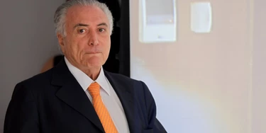 Brazilian President Michel Temer arrives to the presentation of the Investment Partnerships Program at Planalto Palace in Brasilia, on September 13, 2016. The government announced the concession or sale of 30 projects in the areas of energy, airports, roads, ports, railways and mining. According to the president, the package aims to increase investments to reflate the economy in recession and stimulate job creation. / AFP / EVARISTO SA (Photo credit should read EVARISTO SA/AFP/Getty Images) Brazilian President Michel Temer arrives to the presentation of the Investment Partnerships Program at Planalto Palace in Brasilia, on September 13, 2016. The government announced the concession or sale of 30 projects in the areas of energy, airports, roads, ports, railways and mining. According to the president, the package aims to increase investments to reflate the economy in recession and stimulate job creation. / AFP / EVARISTO SA (Photo credit should read EVARISTO SA/AFP/Getty Images)