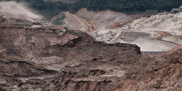 General view of the rebuilding site next to the collapsed iron ore waste dam of Brazilian mining company Samarco, in Mariana, Minas Gerais State, Brazil, on October 26, 2016.Next November 5 marks the first anniversary of the burst of the iron ore waste dam of Samarco -owned by BHP Billiton and Vale SA- which killed nineteen people and destroyed the ecosystem of the Doce River in the worst mining accident in Brazil's history. / AFP / YASUYOSHI CHIBA (Photo credit should read YASUYOSHI CHIBA/AFP/Getty Images)